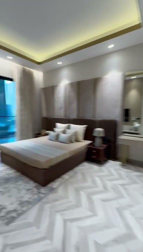 Bedroom in a furnished Ashtech residence, a still from the interiors walkthrough