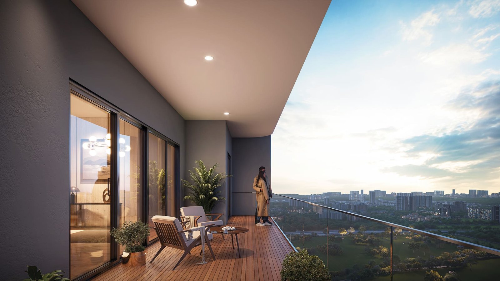 Wraparound balcony of a 3 BHK residence at Ashtech Presidential Towers overlooking Greater Noida West at dusk